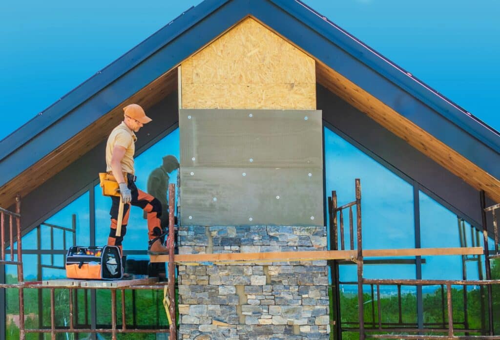 Contractor Installing Rocky Chimney Facade