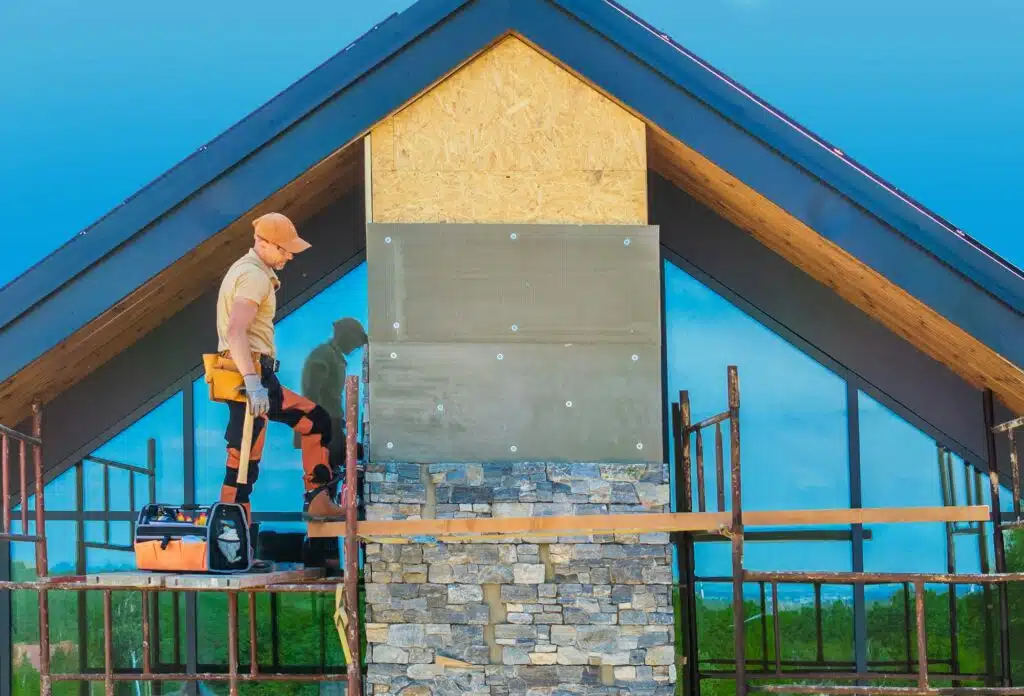 Contractor Installing Rocky Chimney Facade